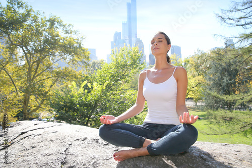 Woman doing yoga exercises in Central Park, NYC © goodluz