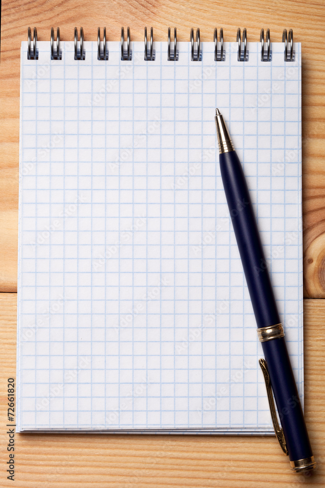 Pen and notebook on wooden table. Pen and notebook on wooden table.