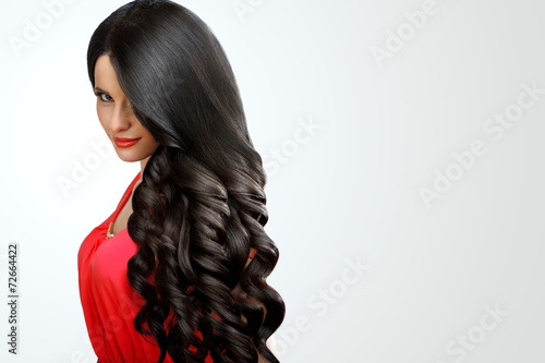 Hair. Portrait of Beautiful Woman with Black Wavy Hair. High qua