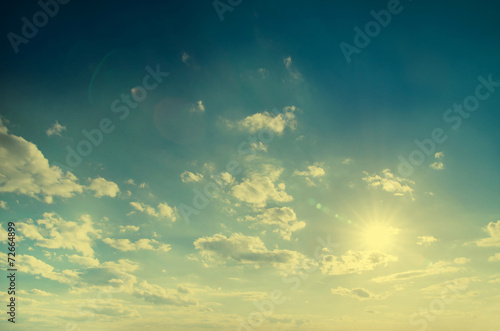 Vintage background in the blue shade with clouds