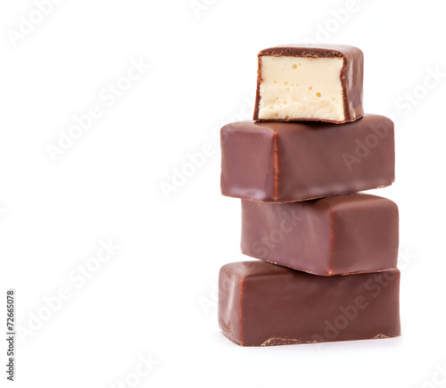 Delicious chocolates on a white background.