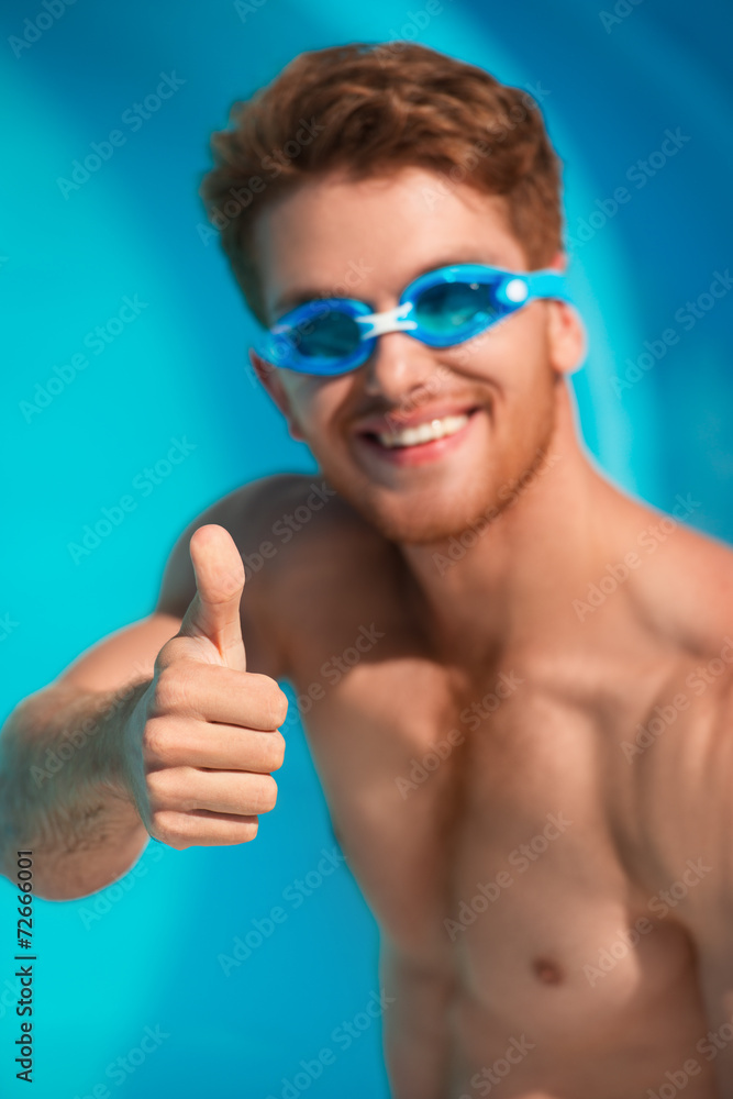 Close-up of smiling man in watersport goggles Close-up of smiling man in watersport goggles