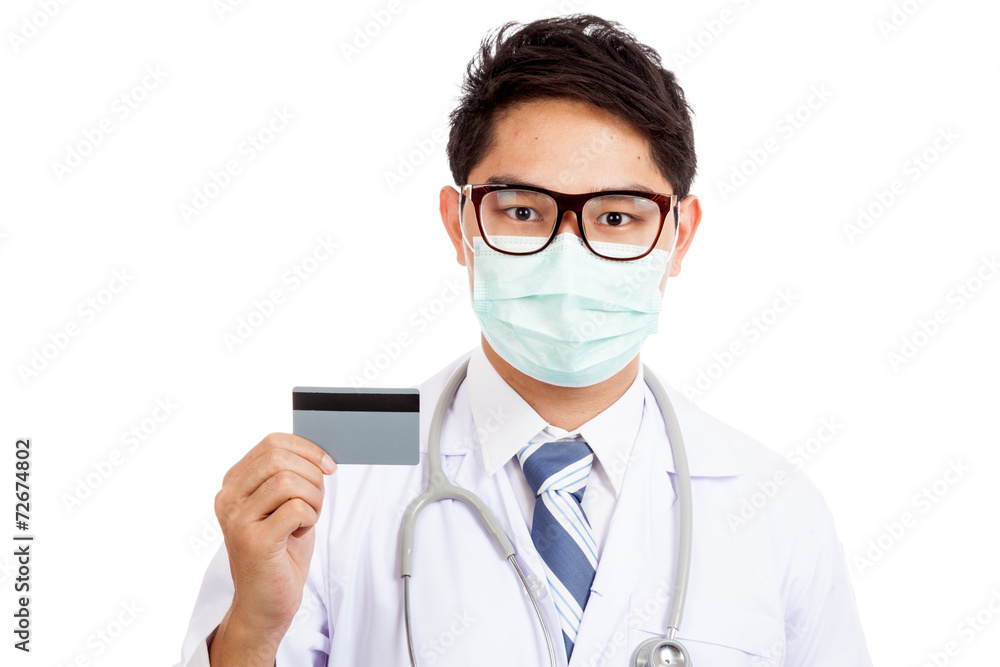 Asian male doctor wear mask with credit card Asian male doctor wear mask with credit card