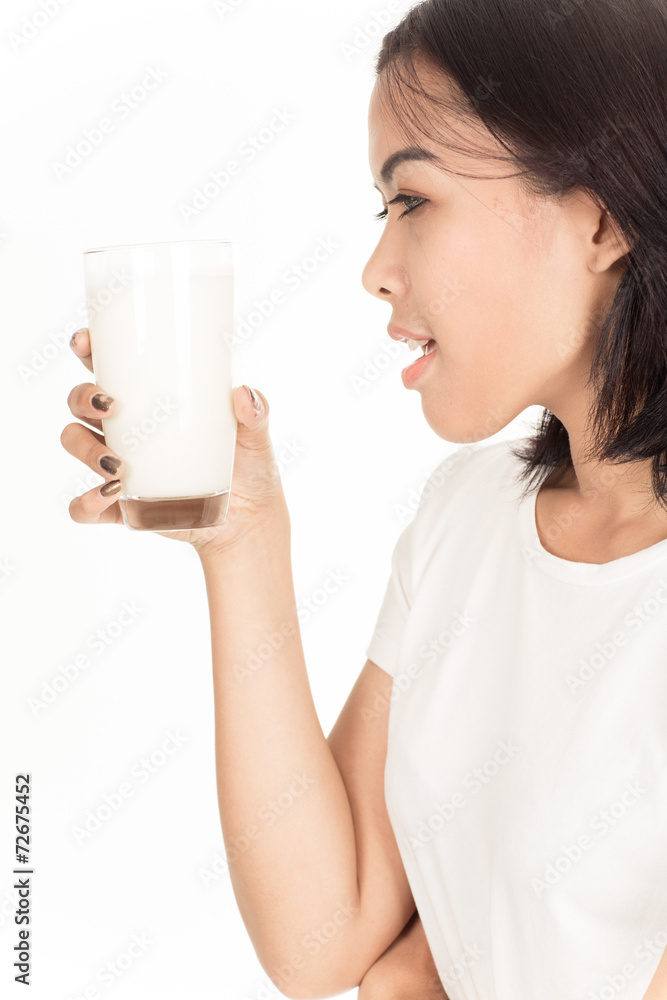 Laughing young woman with a glass of milk Laughing young woman with a glass of milk