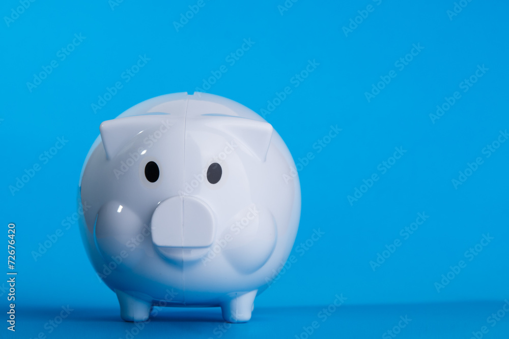 Piggy bank on blue background Piggy bank on blue background