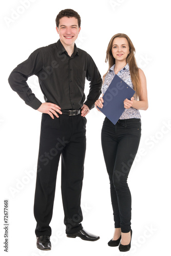 A portrait of a businesswoman and a businessman standing in full