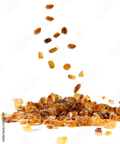 Slices of falling brown candy sugar