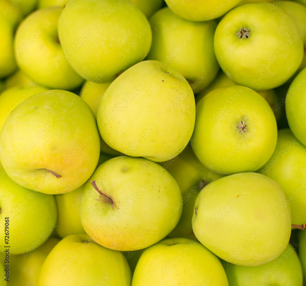 Bunch of green apples in supermarket.