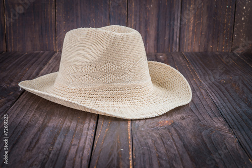 Beach hat on wooden background