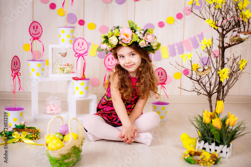 Easter concept. Beautiful girl in the room with decorations