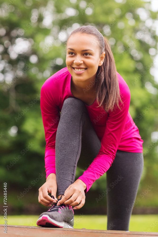 smiling woman exercising outdoors smiling woman exercising outdoors