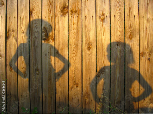 Shadow of boy and girl staring each other