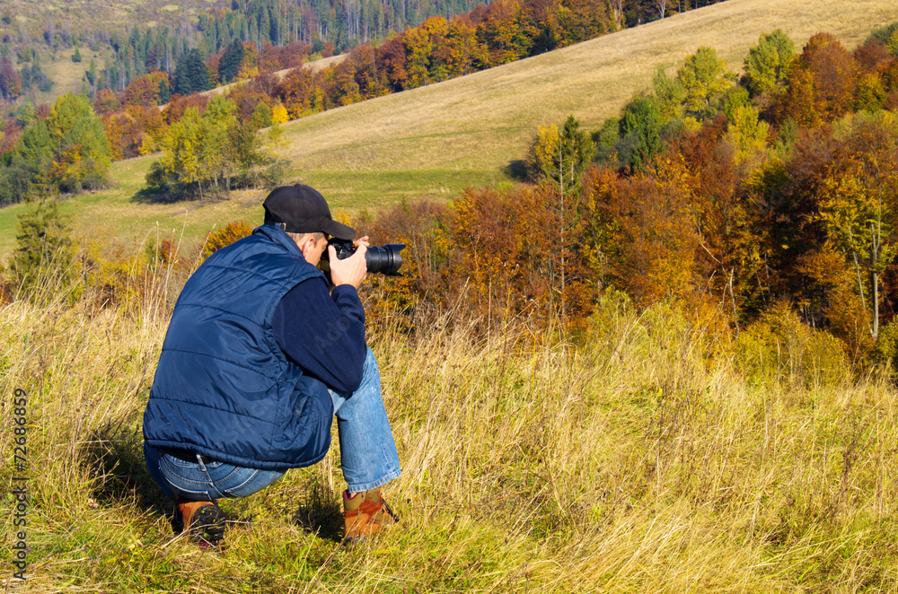 Man photographer in the mountains forest. Man photographer in the mountains forest.