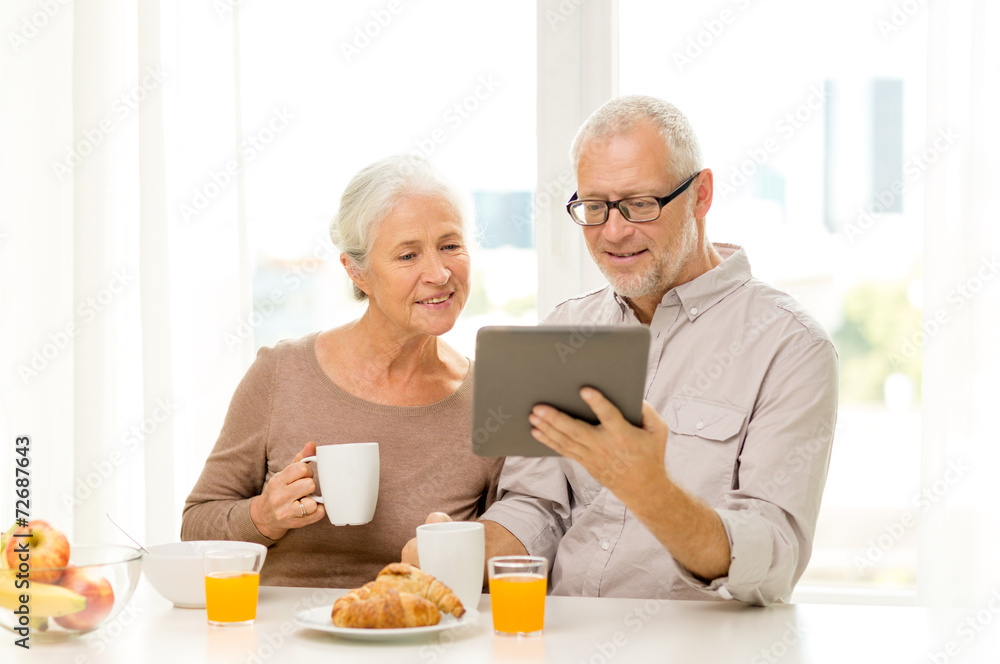 happy senior couple with tablet pc at home happy senior couple with tablet pc at home