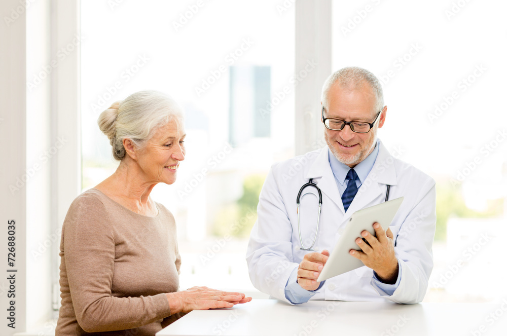 smiling senior woman and doctor with tablet pc smiling senior woman and doctor with tablet pc