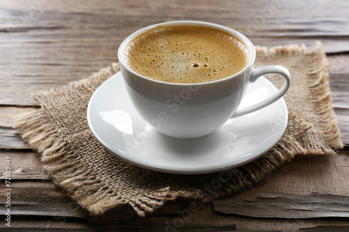 Cup of coffee on wooden table