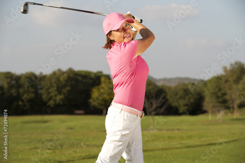 beautiful senior female golf player
