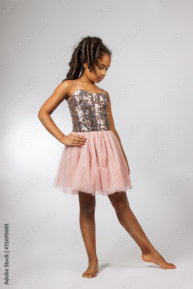 Naklejka premium Cute little girl dance. Studio shot