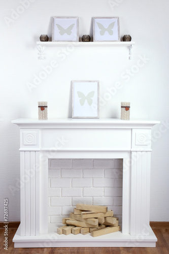 Fireplace with beautiful decorations in comfortable living room