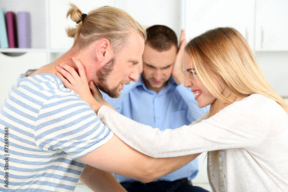 Young couple with problem on reception for family psychologist Young couple with problem on reception for family psychologist