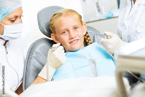 Dentist inspecting patient