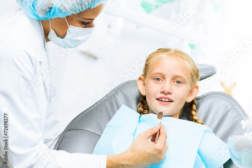 Dentist inspecting patient