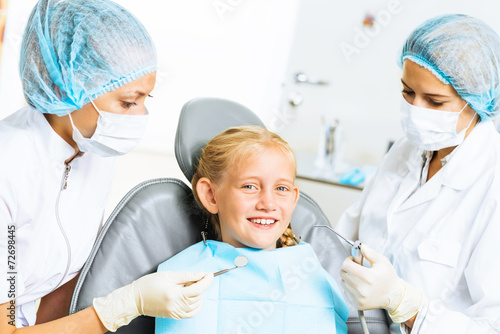 Dentist inspecting patient