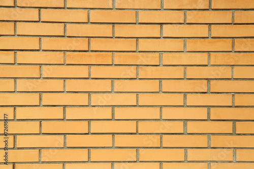 Orange brick wall close-up background