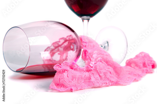 two glasses of red wine on a white background of about pink pant photo