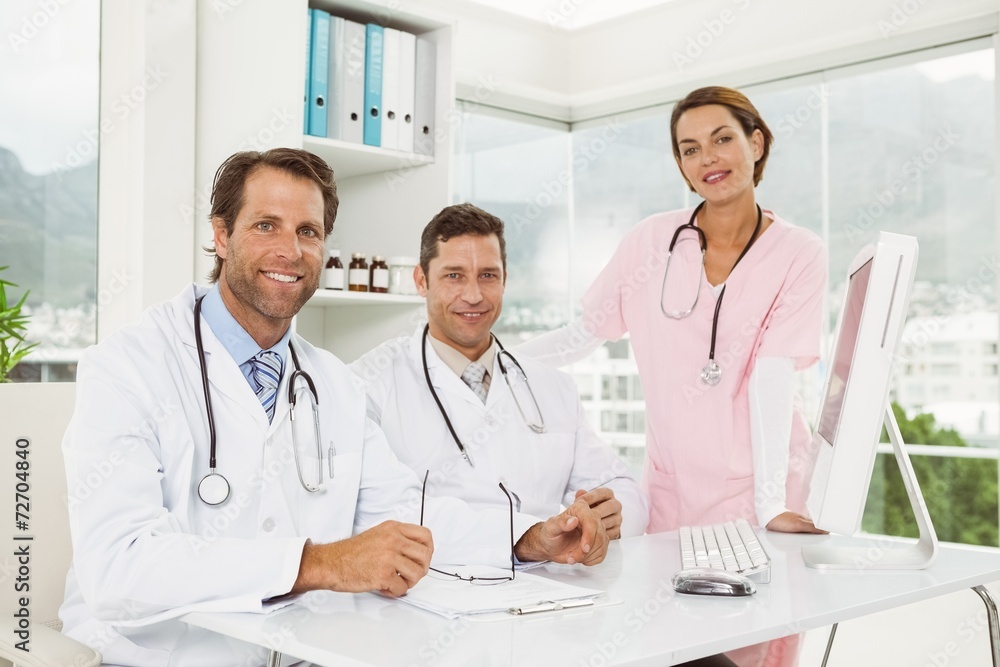 Confident doctors smiling at medical office