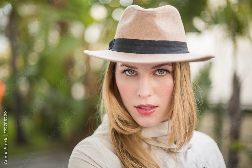 Cheerful blonde with hat posing Cheerful blonde with hat posing