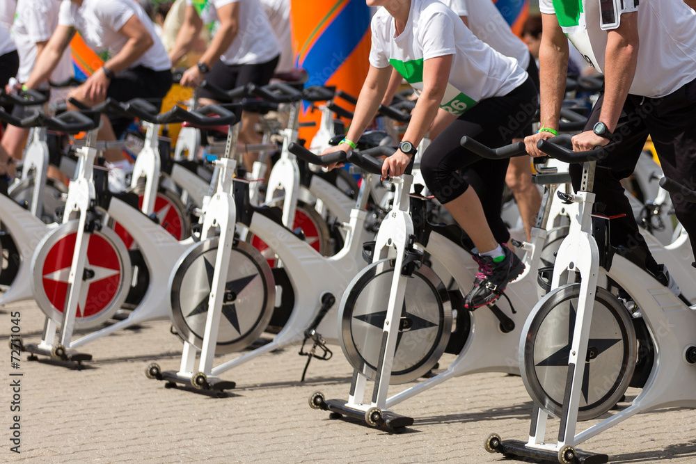 Fototapeta premium Stationary spinning bicycles outdoor in a sunny day. aerobic