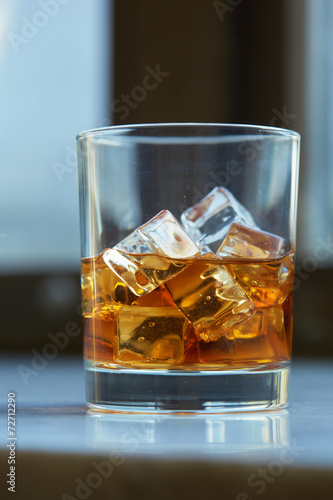 whiskey with ice on a table