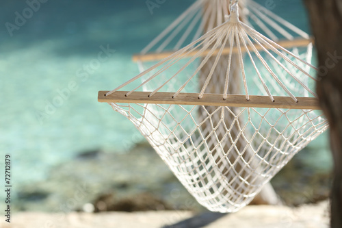 Fototapeta Naklejka Na Ścianę i Meble -  Tropical beach vacation concept with a hammock