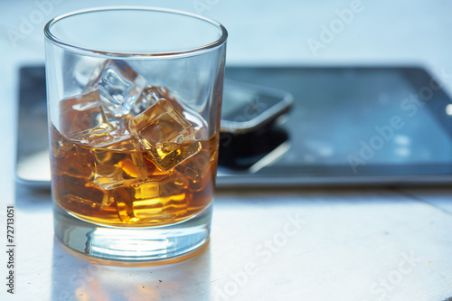 whiskey with ice on a table