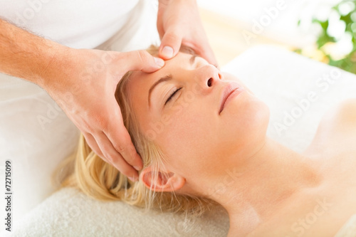 Massaging Forehead