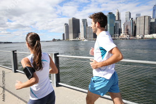 Couple of joggers running on Brooklyn Heights Promenade