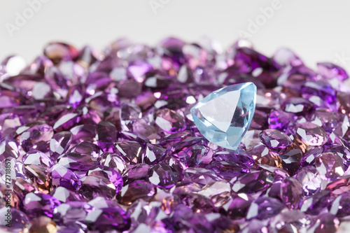 Natural topaz on background of natural amethyst photo