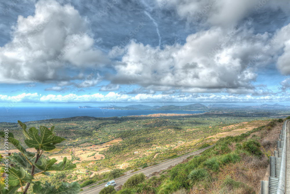 Obraz premium Alghero coastline under dramatic clouds