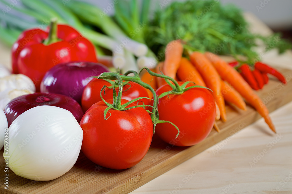 Fresh vegetables on a wooden board Fresh vegetables on a wooden board