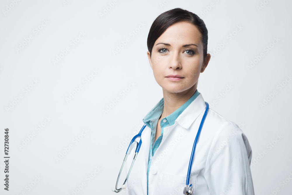 Confident female doctor with lab coat Confident female doctor with lab coat