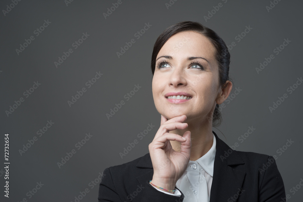 Smiling businesswoman with hand on chin Smiling businesswoman with hand on chin