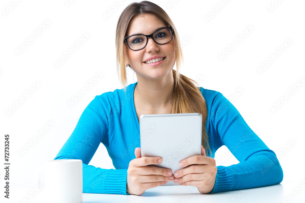 Young smiling woman using digital tablet. Isolated on white. Young smiling woman using digital tablet. Isolated on white.
