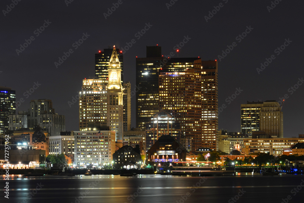 Naklejka premium Boston City Skyscrapers and Boston Waterfront at night