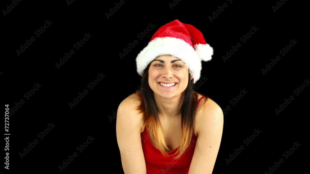 Festive brunette blowing over hands Festive brunette blowing over hands