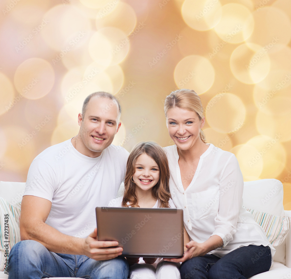 smiling family with laptop smiling family with laptop