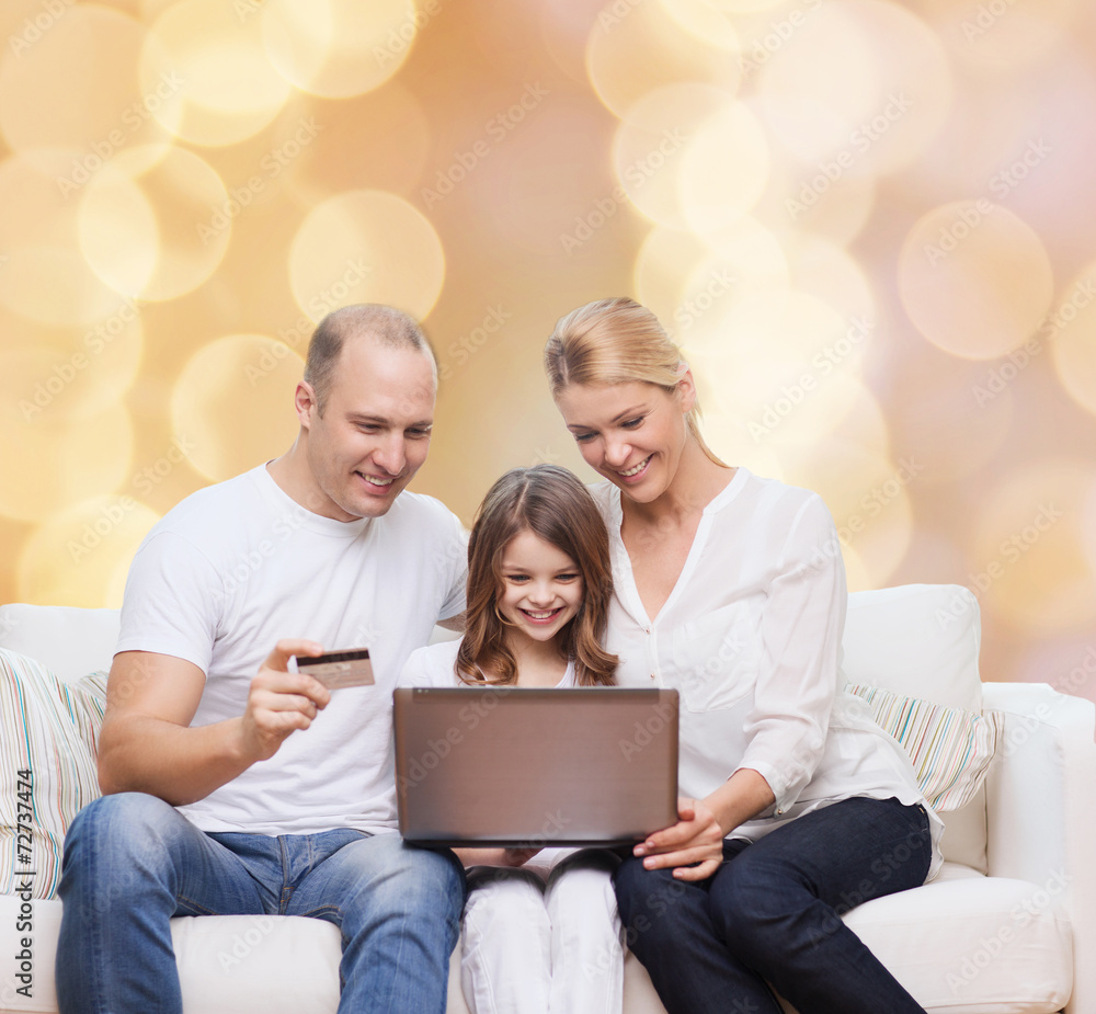 happy family with laptop computer and credit card happy family with laptop computer and credit card