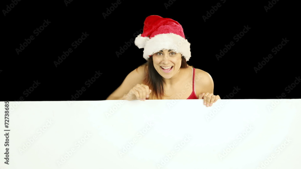 Beauty brunette in santa hat showing white poster Beauty brunette in santa hat showing white poster