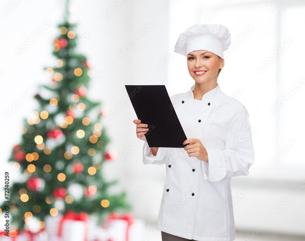 smiling female chef with black blank paper smiling female chef with black blank paper