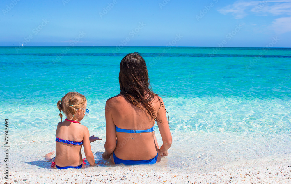Young mother and adorable little girl during summer vacation